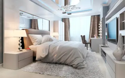 Chambre moderne avec un grand lit douillet, un miroir au dessus du lit reflétant le plafond design et une télévision murale.