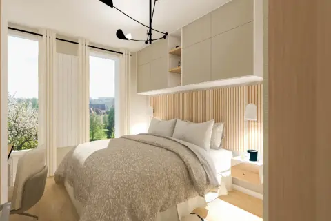 Une chambre parentale lumineuse avec un lit douillet, des rangements muraux et une vue sur un jardin fleuri.