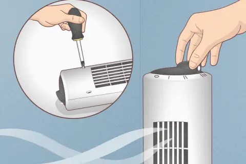 Démontez le ventilateur colonne avec un tournevis pour le nettoyer. Une main tourne le bouton de réglage.