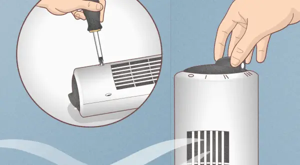 Démontez le ventilateur colonne avec un tournevis pour le nettoyer. Une main tourne le bouton de réglage.