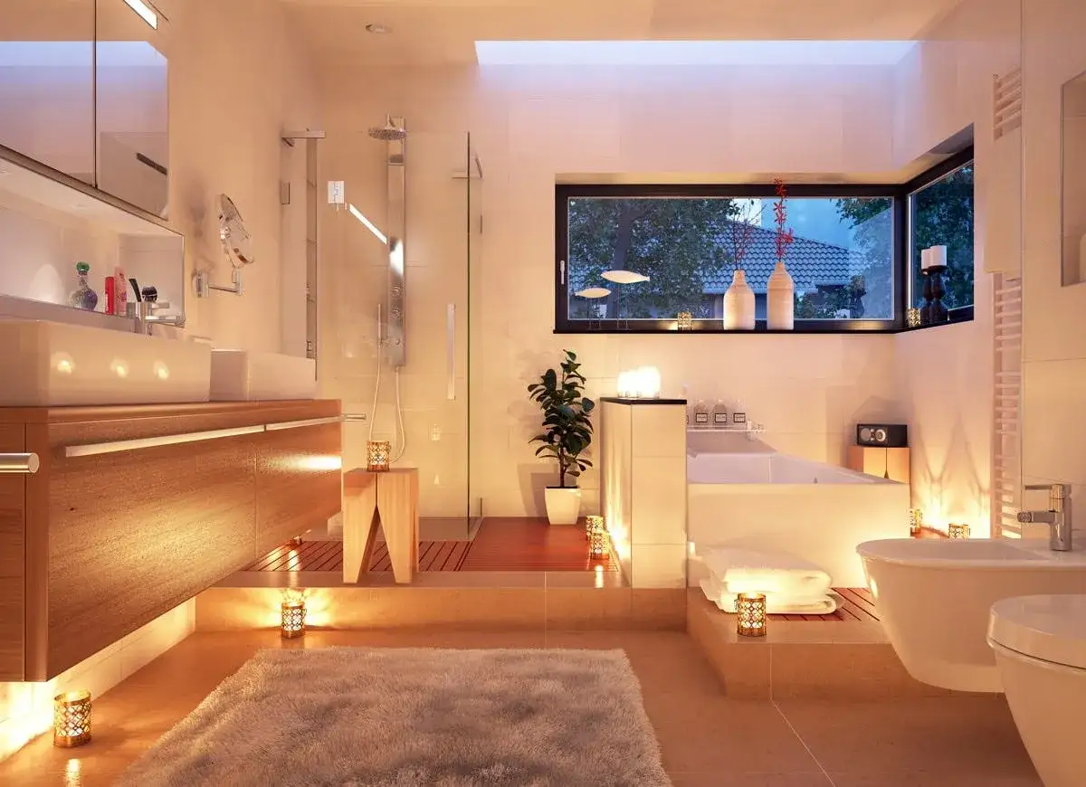 Salle de bain moderne et luxueuse, &eacute;clair&eacute;e par des bougies et des lumi&egrave;res indirectes. Une id&eacute;e pour comment &eacute;clairer une pi&egrave;ce sans fen&ecirc;tre.